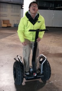 a man standing on a segway