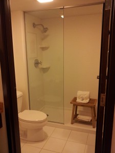 a bathroom with a glass shower door