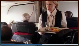 a woman holding a tray of food