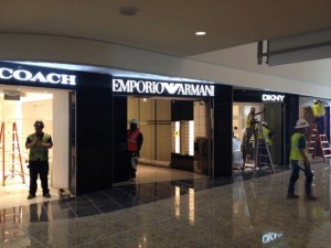 a group of men standing in front of a store
