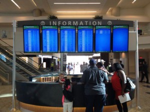 a group of people standing in front of a information desk