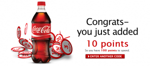 a bottle of soda next to a pile of chips