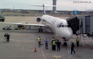 a group of people standing around an airplane