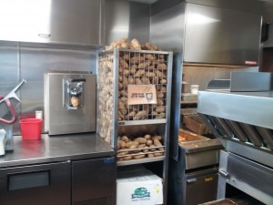 a large metal rack full of potatoes