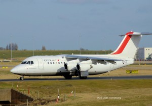 a white airplane on a runway