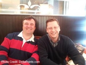 a couple of men sitting at a table