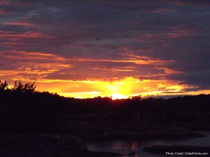 a sunset over a body of water