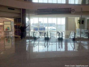 a man standing in front of a large window