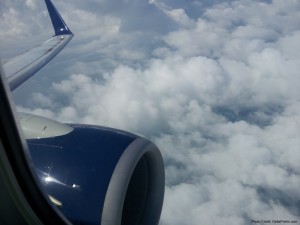 an airplane wing and clouds