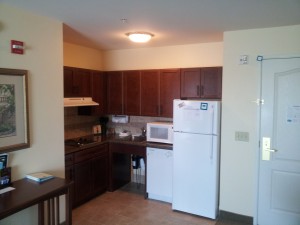a kitchen with white appliances