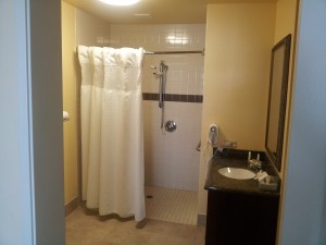 a bathroom with a shower and sink