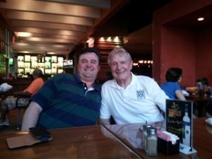 two men sitting at a table