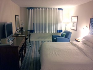 a room with a bed and a desk