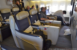a group of people sitting in an airplane