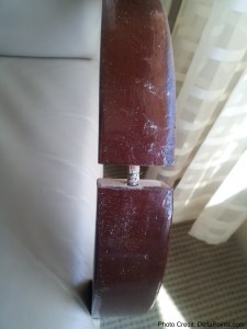 a wooden object on a white surface