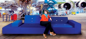 a woman sitting on a blue couch