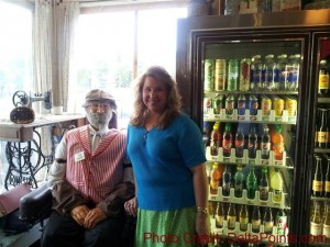 a woman standing next to a man in a wheelchair