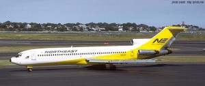 a yellow and white airplane on a runway