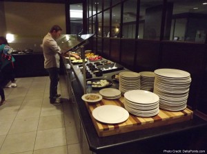 a man standing at a buffet