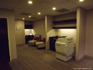 a room with a printer and chairs