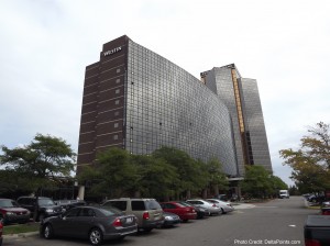 a building with many cars parked in front of it