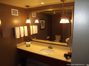 a bathroom with a mirror and sink