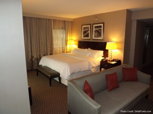 a hotel room with a bed and couch