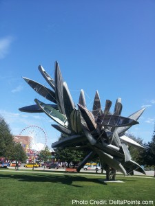 a sculpture of boats in a park