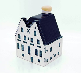 a small white and black house