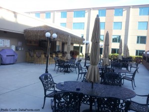 a patio with tables and chairs