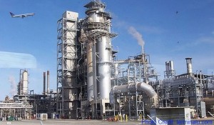 a factory with a lot of smoke coming out of it