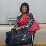 a woman sitting on a chair with a bag