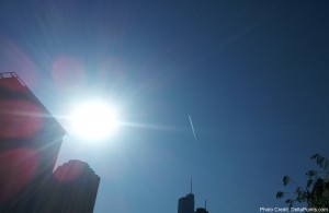 the sun shining through the sky