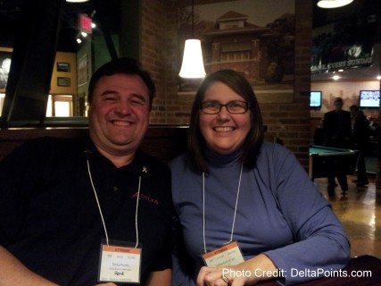a man and woman sitting together smiling
