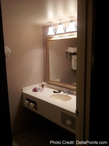 a bathroom with a mirror and sink