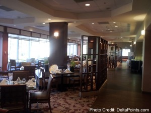 a restaurant with a glass partition