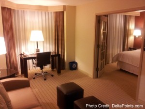 a room with a bed and a desk