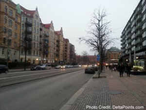 a street with buildings and cars