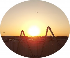 a sunset over a building