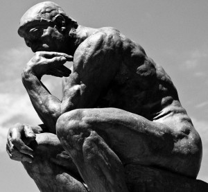 a statue of a man thinking