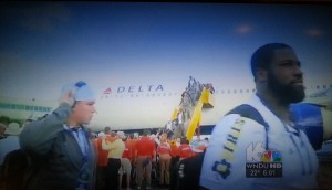 a group of people walking up a plane