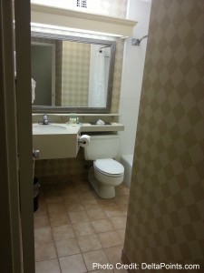 a bathroom with a mirror and sink