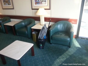 a chair and a suitcase in a room