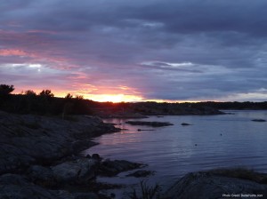 a sunset over a body of water