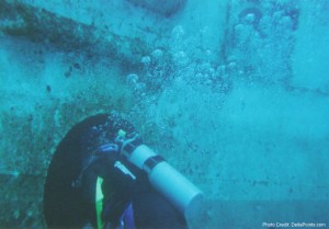 a scuba diver with a tube in the water