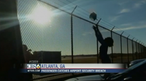 a person reaching up to a fence