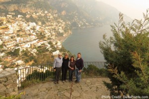 a group of people standing on a rock