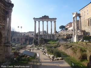 a stone structure with columns in the background