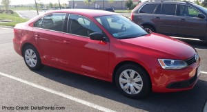 a red car parked in a parking lot
