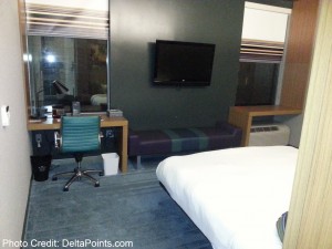 a room with a bed and a desk